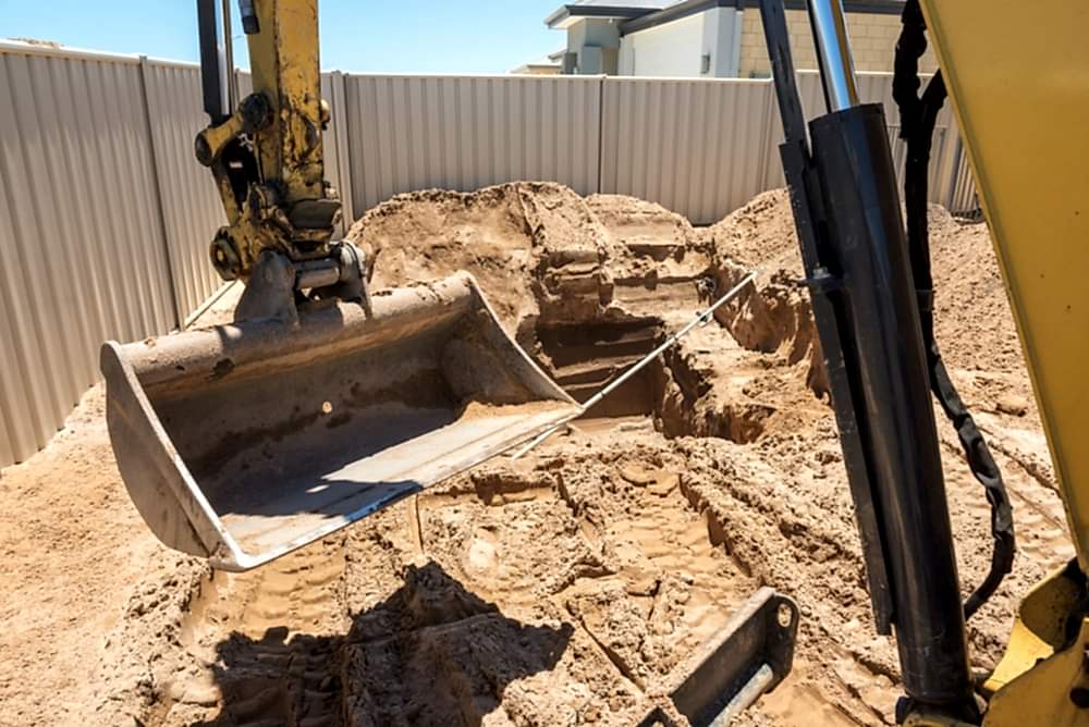 Excavation works for the installation of a swimming pool.Swimming pool under construction.